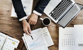 Accountant reviewing financial reports and tax documents